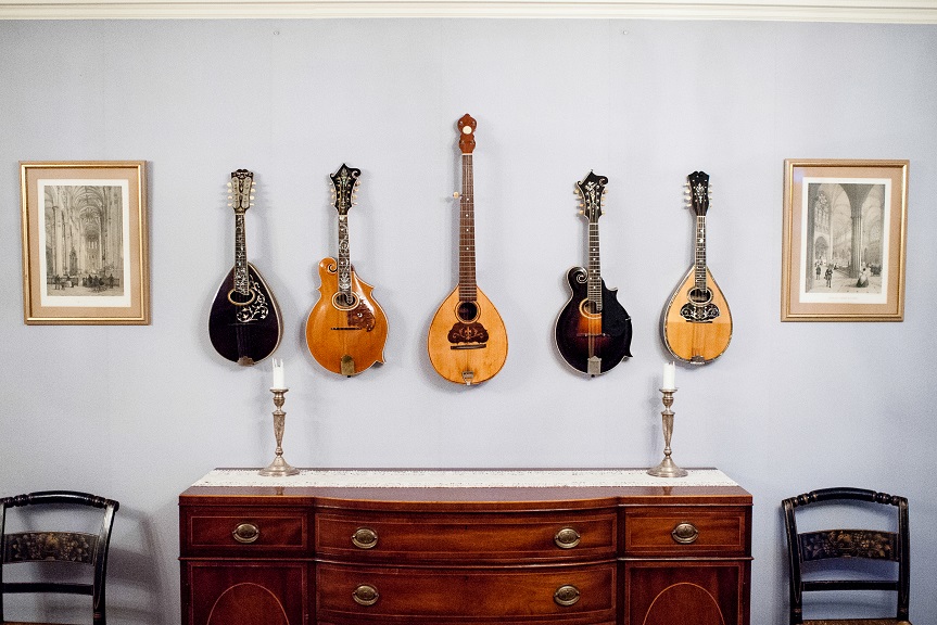 Some of RIT President Bill Destler's Mandolin and Banjo collection in the formal dining room at his home, Liberty Hill. Photo: William J. Ignalls