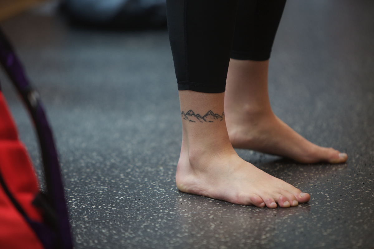 Kelly Roger's ankle tattoo juxtaposed with one on her shoulder, reflect the highs and lows of existence. 