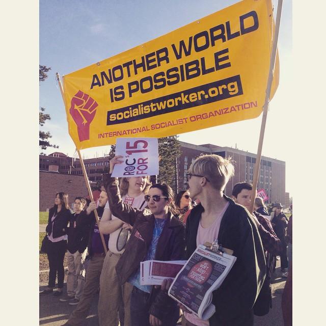 Protesters gather at a fight for 15 rally, where the organization protested for a $15 minimum wage in April 2015. Photograph provided by the International Socialist Society. 