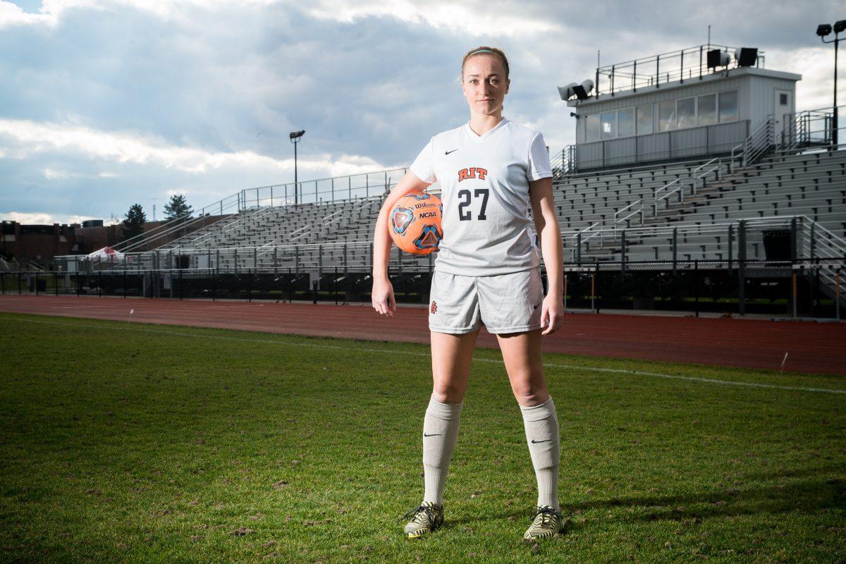 Natalie Hurd poses for portrait on RIT's soccer field. Photograph by Rob Rauchwerger. 