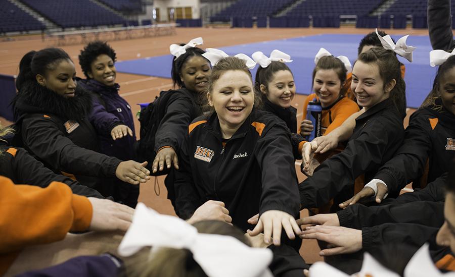 Rachel Beckham (center) and the RIT cheerleading team leave the competetion at the Empire Cheer Winter Classic at the Rochester Institute of Technology in Rochester, N.Y. on Feb. 13, 2016. Photograph by Joseph Ressler.