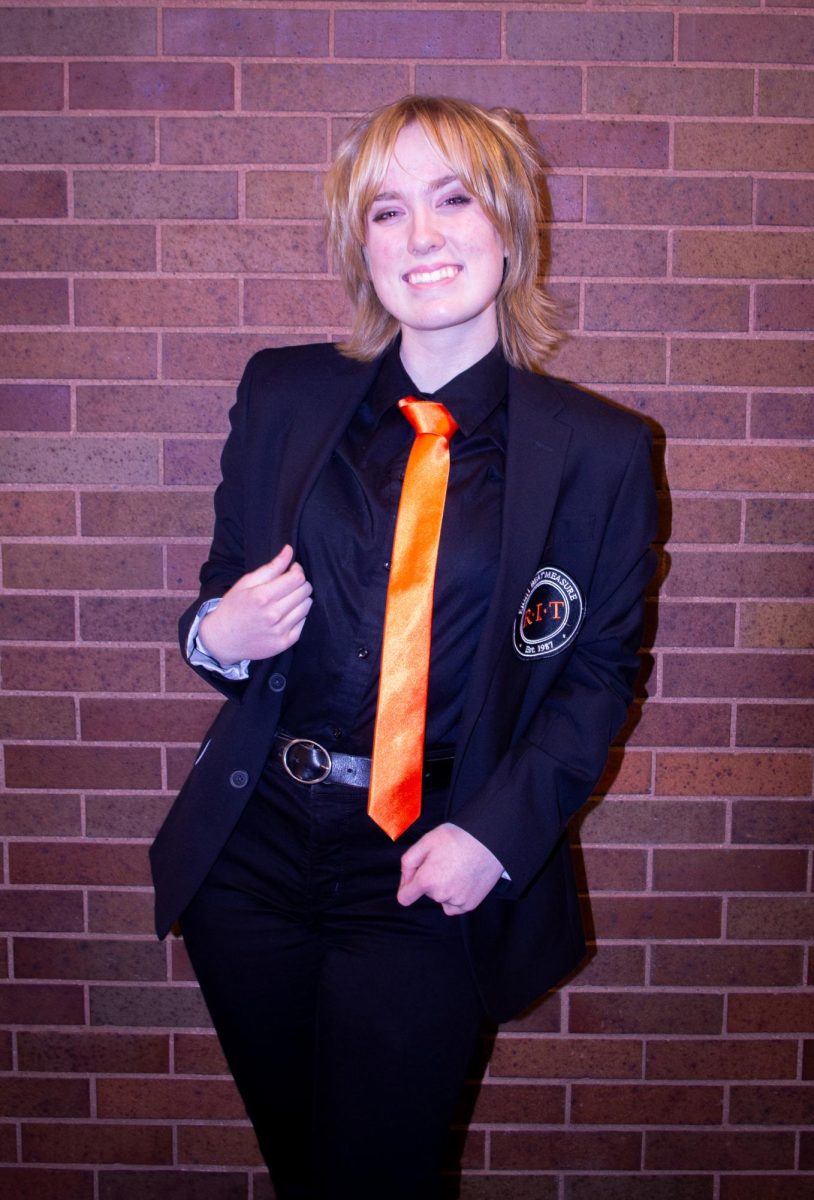 Anna Widger, the first female member of Eight Beat Measure, at the RIT
Interfaith Center on Jan. 30, 2025, wearing the official uniform of the a
capella group.