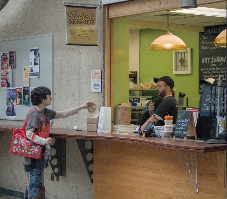 Justin Kirchgessner, the manager of Nathan’s Soup & Salad, talks with a student in RIT's SAU on Oct. 7, 2025 in Henrietta, N.Y.

