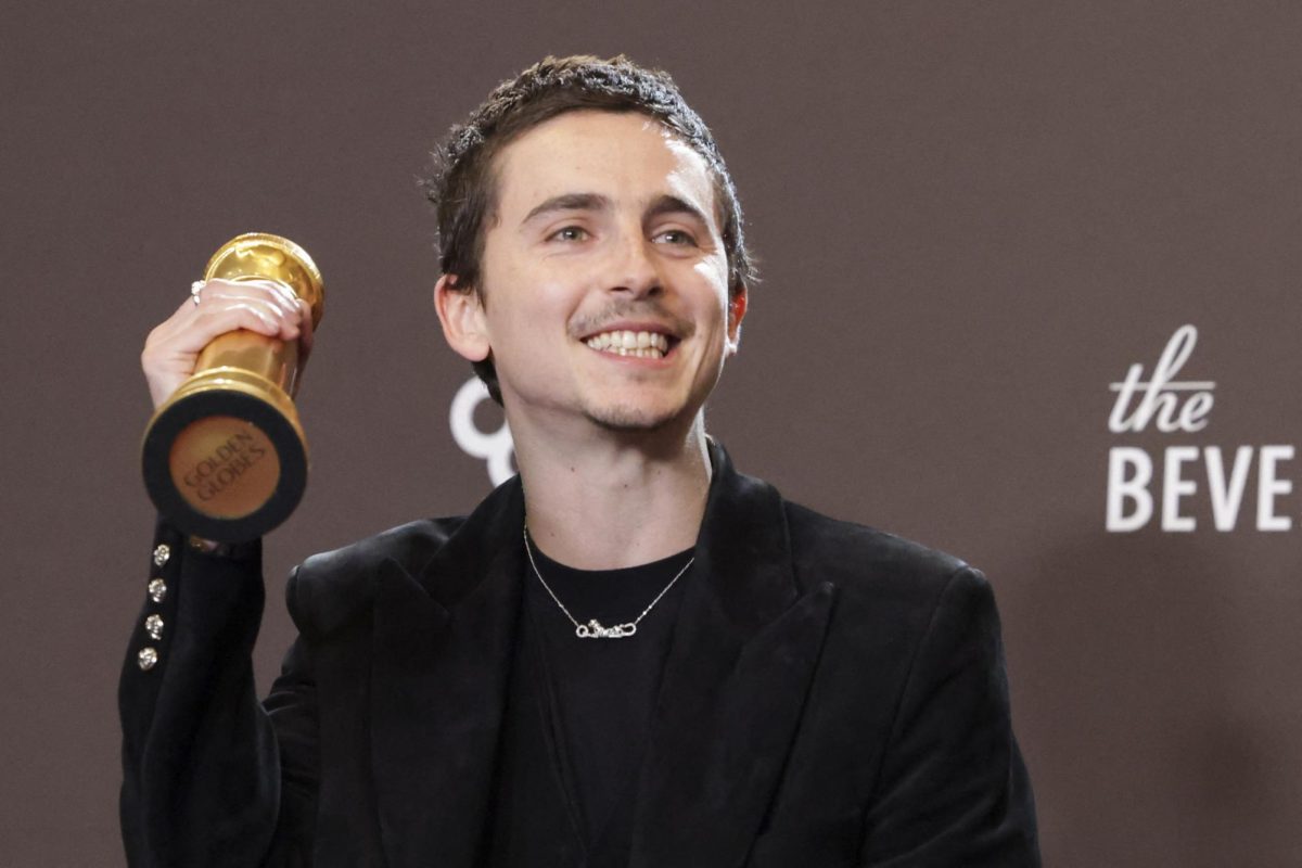 Timothee Chalamet poses with the Best Performance by a Male Actor in a Motion Picture - Musical or Comedy award for "Marty Supreme" at the 83rd Annual Golden Globes in Beverly Hills, California, U.S., January 11, 2026. REUTERS/Mario Anzuoni