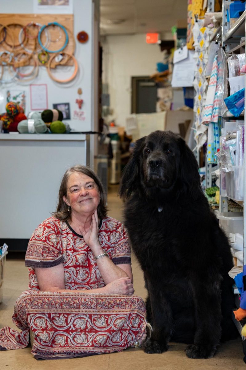 Store owner Sheryl Byers poses with Elenore, the store’s Newfoundland mascot, at Crafting for Good, Inc. in North Chili, NY, Saturday, June 13, 2026. (Reporter Magazine/Colin Rills)