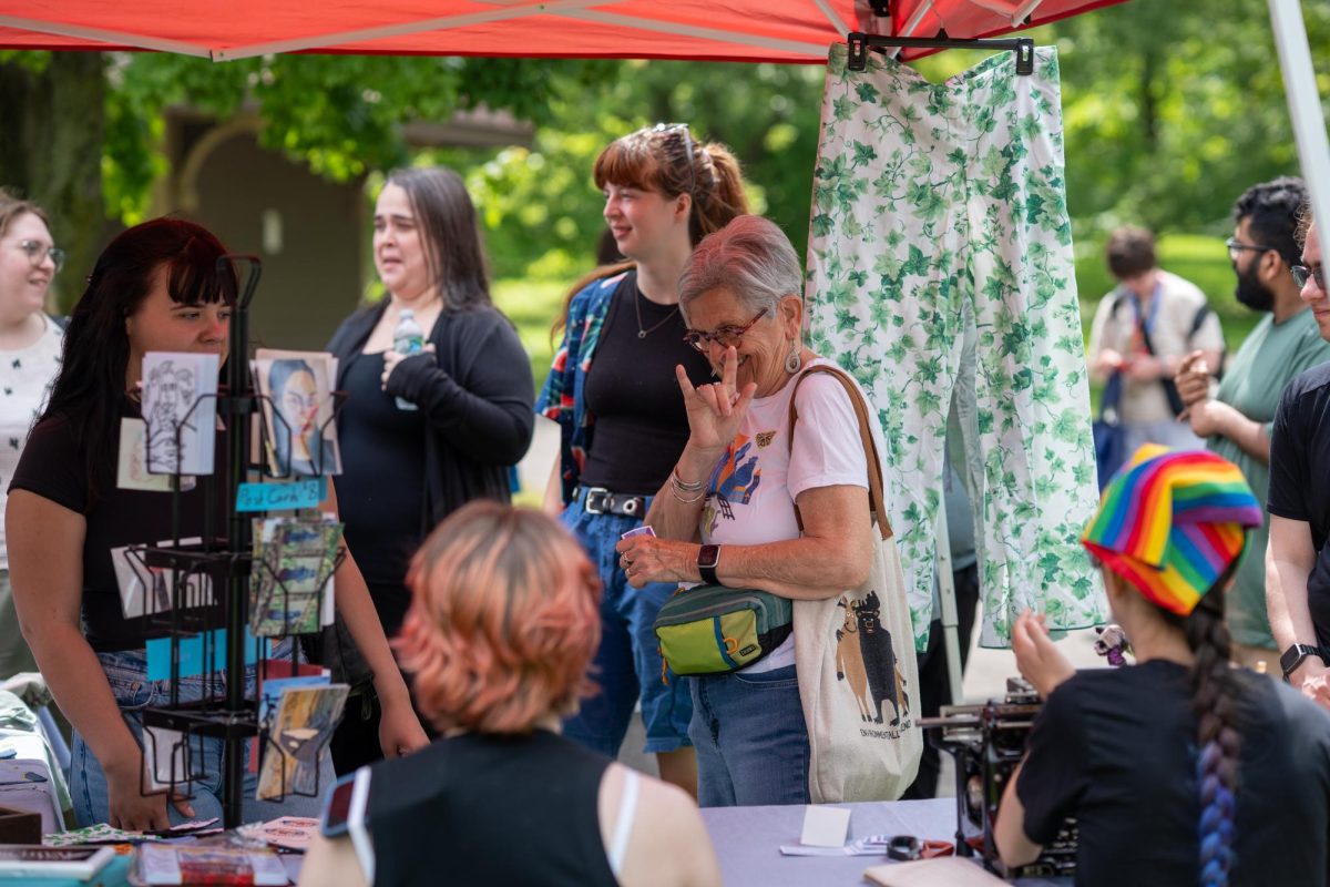 Community members visit Patchwork and Poetry’s tent during the Rochester Deaf Festival in Genesee Valley Park in Rochester, NY, Saturday, June 6, 2026. (Reporter Magazine/Colin Rills)