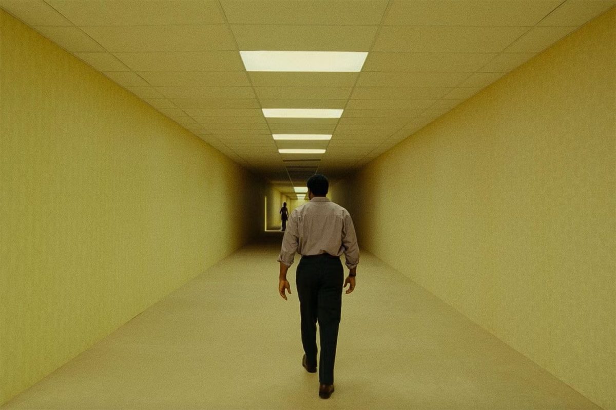 The protagonist, Clark, wanders the hallways of the Backrooms. Photo taken from the Backrooms movie trailer.