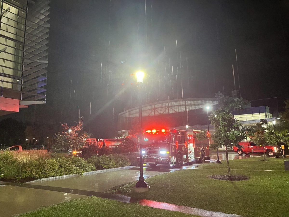 Fire trucks sit in the rain while firemen investigate the cause of the smoke on September 2, 2026.