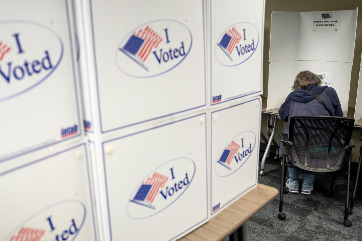 A person votes during early voting at the Alexandria City Registrar Office in Alexandria, Virginia, US, October 7, 2026. REUTERS/Nathan Howard